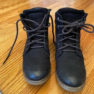 Black booties with brown and black laces.